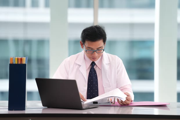 a doctor analyzing the results of a weight loss clinical trial