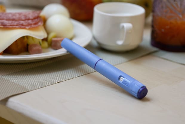 an injectable weight loss pen on a table
