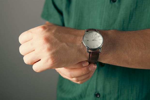 a man's arm with a wristwatch on it