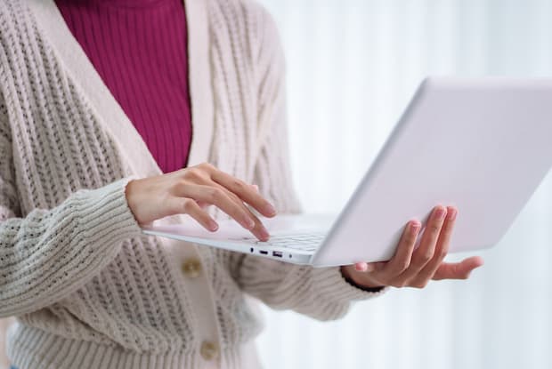 a woman ordering Wegovy online using her laptop