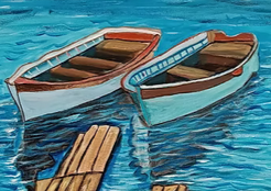 A small image of two painted boats on water.