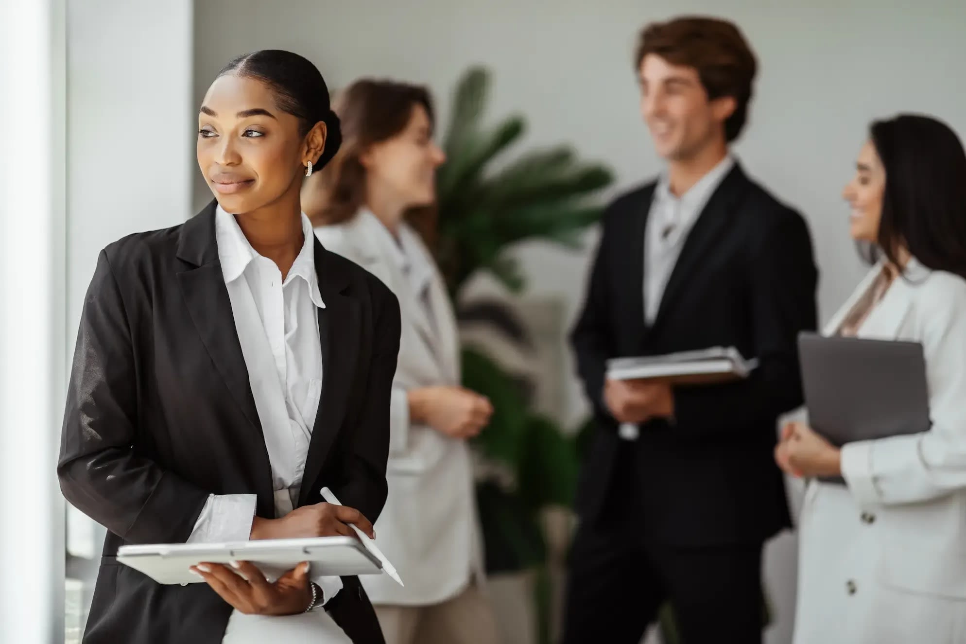 confident-black-female-ceo-with-group-of-colleague-2026-01-08-23-15-33-utc.webp