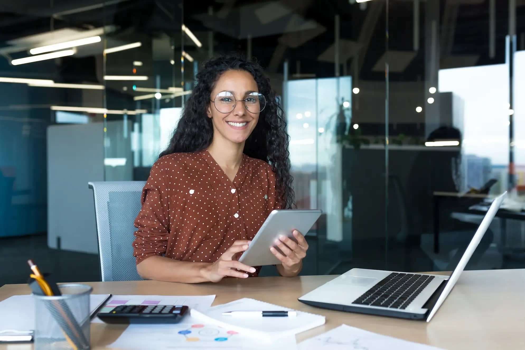 happy-and-successful-hispanic-woman-working-inside-2026-03-24-22-19-57-utc.webp