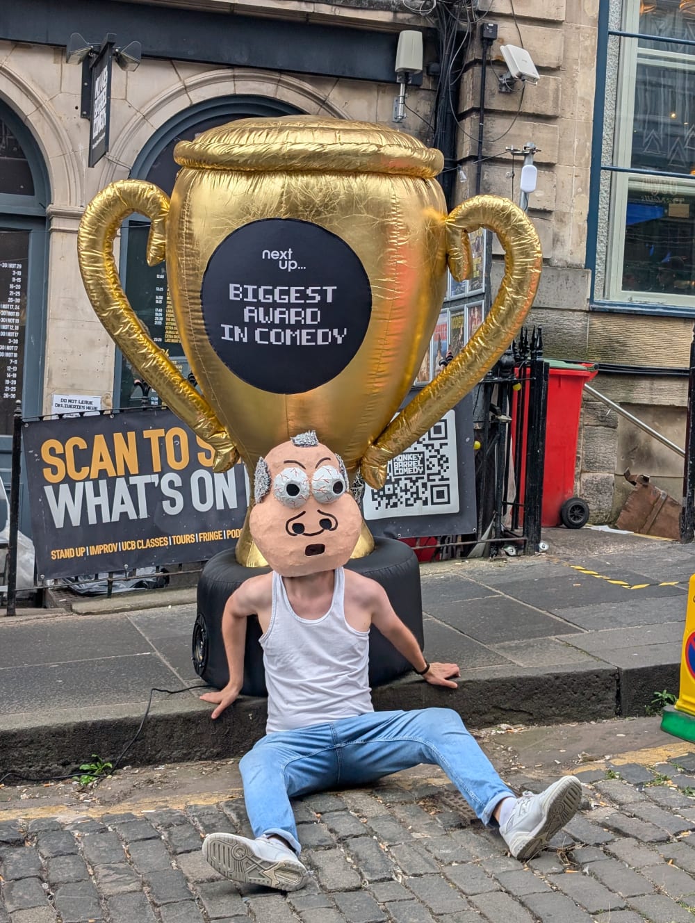 Sam Eley, winner of the Biggest Award in Comedy 2026,
with the trophy