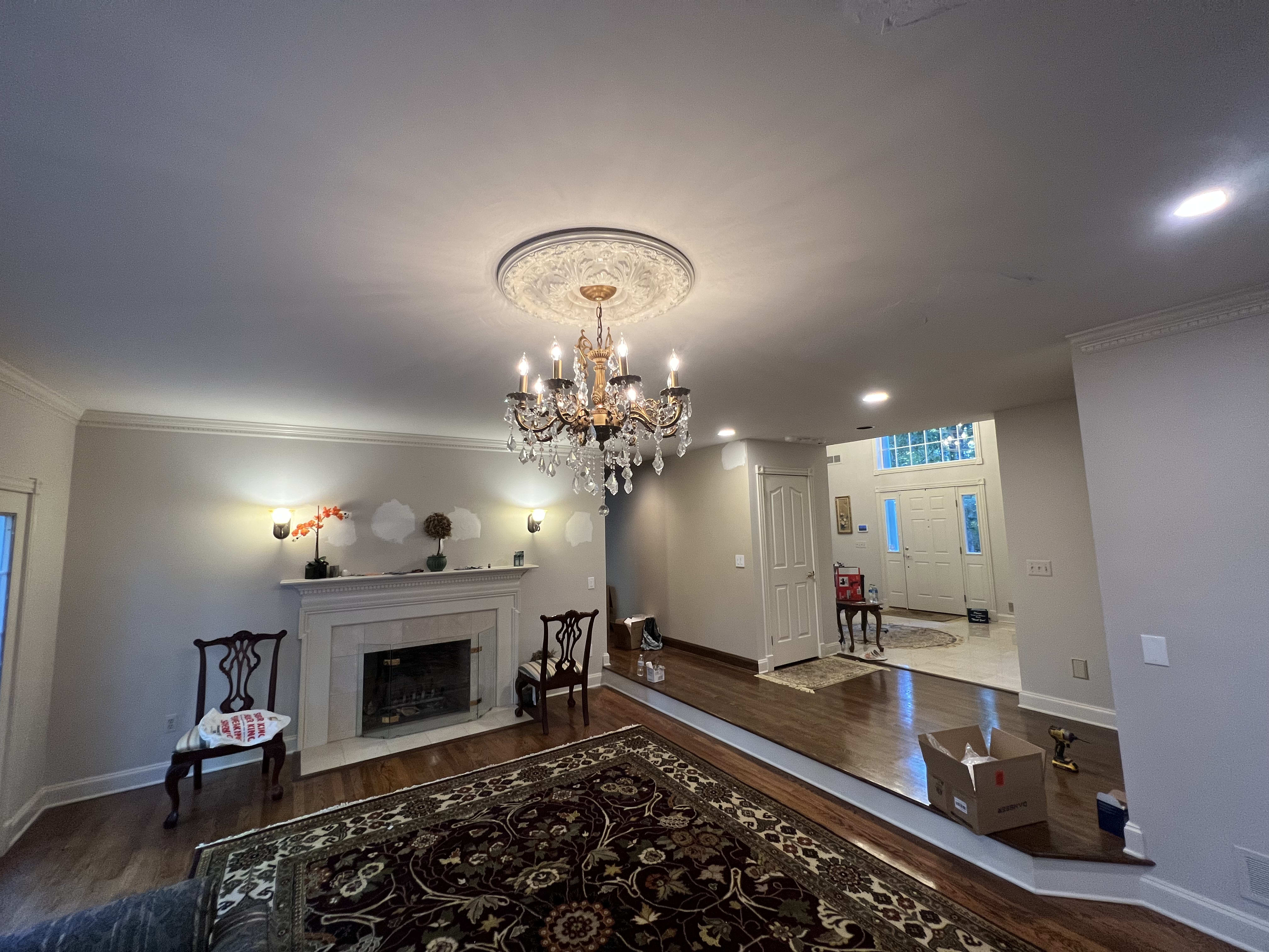 Crystal chandelier and ceiling medallion installation. Clean wiring, careful mounting, and a polished finish that turned the living room into a true focal point.