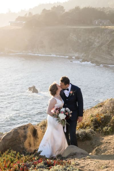 Grace, a Lace & Liberty bride, in her satin wedding dress