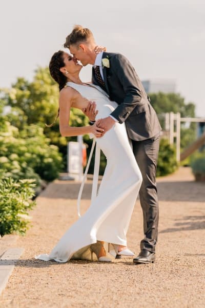 Nicole, a Lace & Liberty bride, in her satin wedding dress