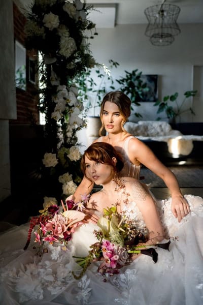 Stunning vneck Aline tulle gown with hand applique lace throughout. Semi-sheer bodice, exposed boning detailing.