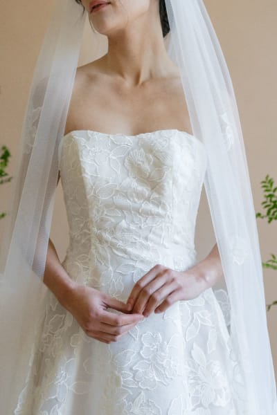 Bride wearing long lace veil