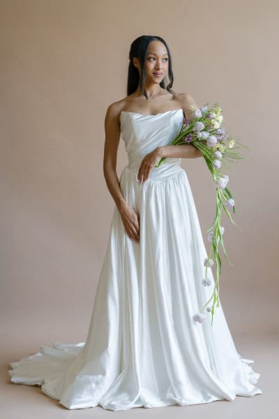 This elegant gown is a strapless A-line wedding dress