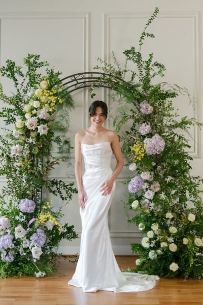 This minimalist satin gown stuns with its sleek lines and curve-enhancing fit-and-flare shape