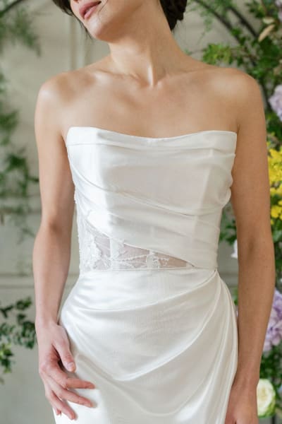 This minimalist satin gown stuns with its sleek lines and curve-enhancing fit-and-flare shape