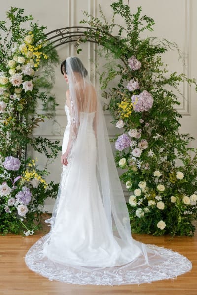 Bride wearing long lace veil
