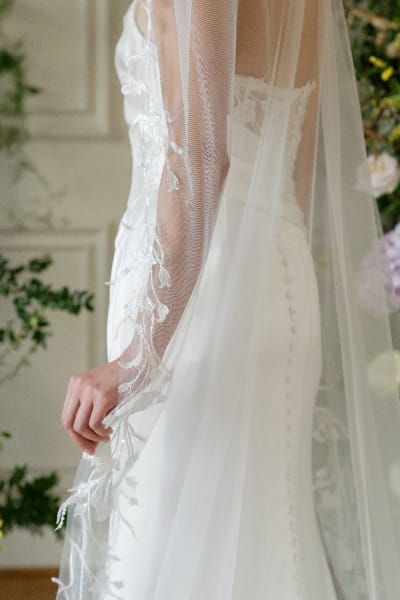 Bride wearing long lace veil