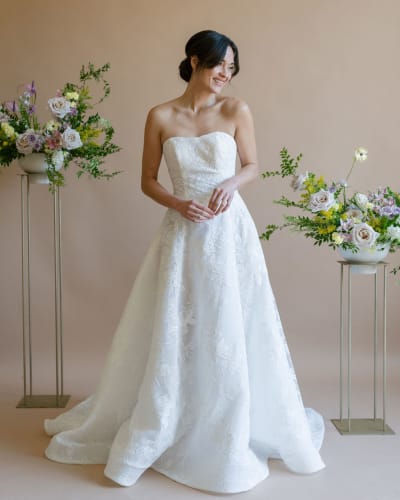 A-line wedding dress featuring a fitted bodice that flows into a voluminous skirt