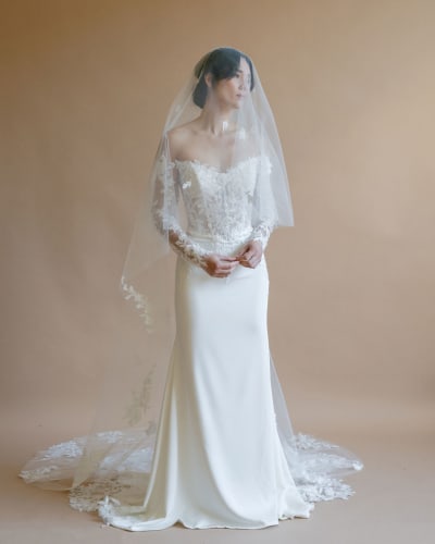 Bride wearing long lace veil