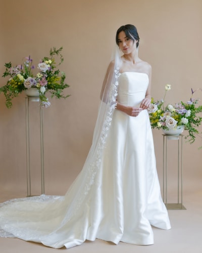 Bride wearing long lace veil