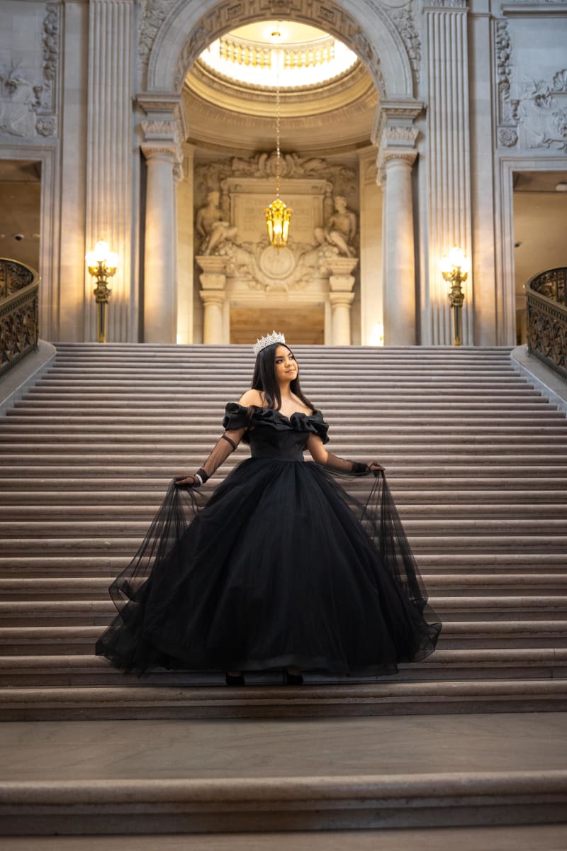 Bride on the steps of San Francisco City Hall in a black ballgown and tiara
