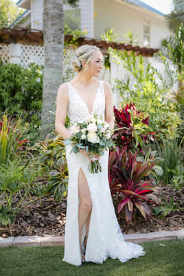 Lace and Liberty bride smiling with her husband next to the Golden Gate Bridge