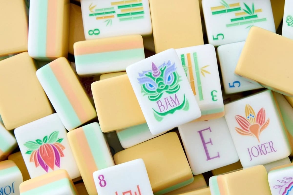 Variety of Oh My Mahjong sets with carrying cases and racks