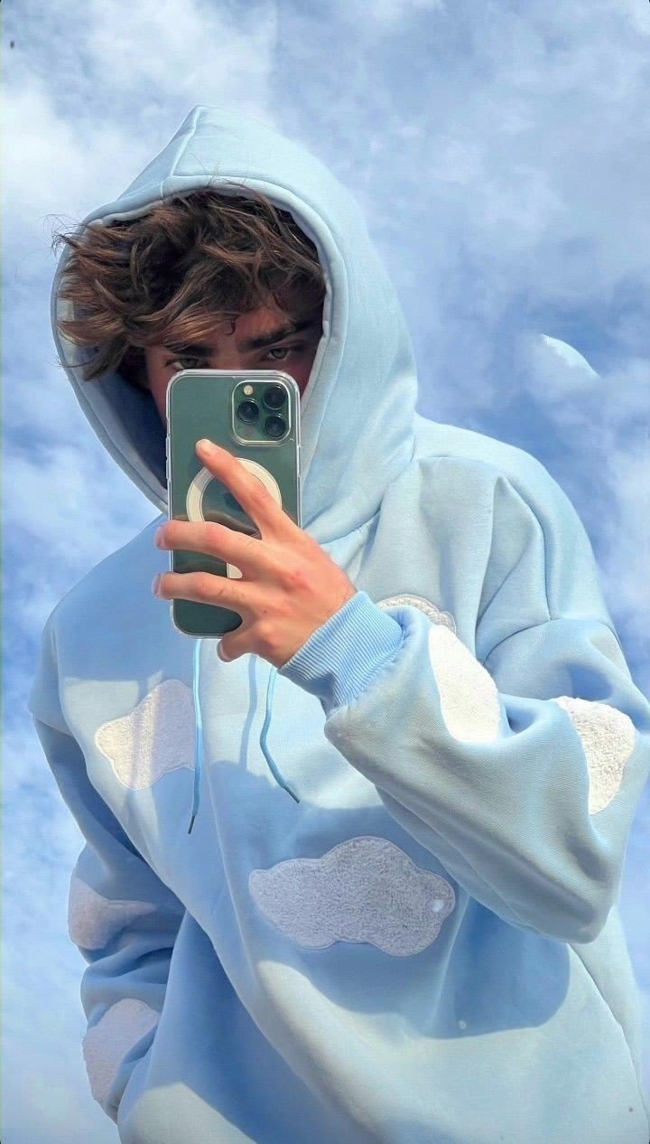 Boy leaning down covering face