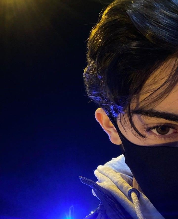 Dark themed hidden face boy image