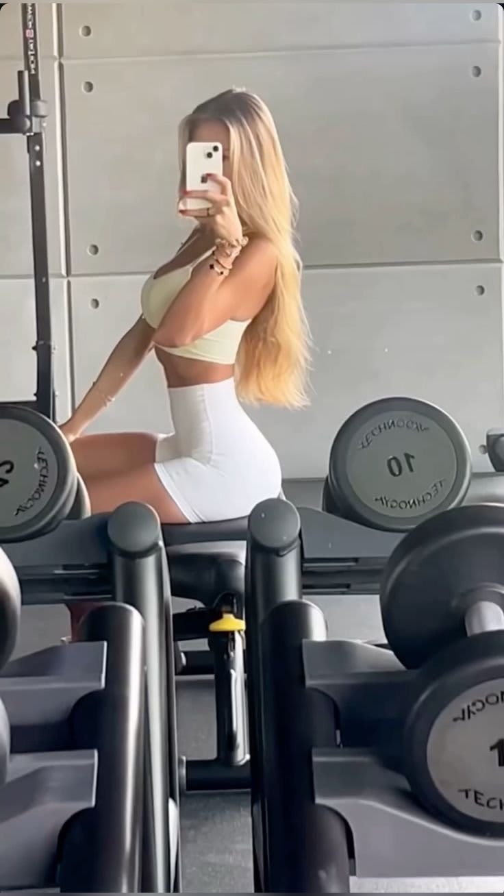 Motivated UK Gym Girl exercising with resistance bands