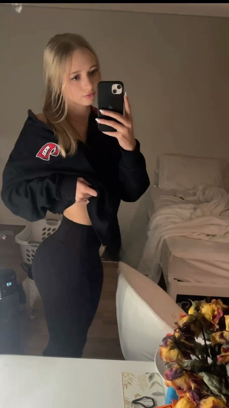 UK Gym Girl stretching before intense workout session