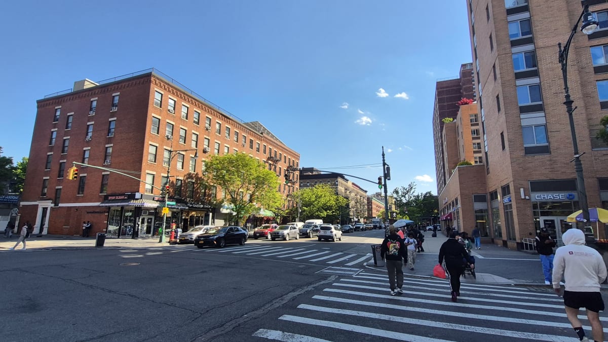 residential street with multifamily walk-up buildings