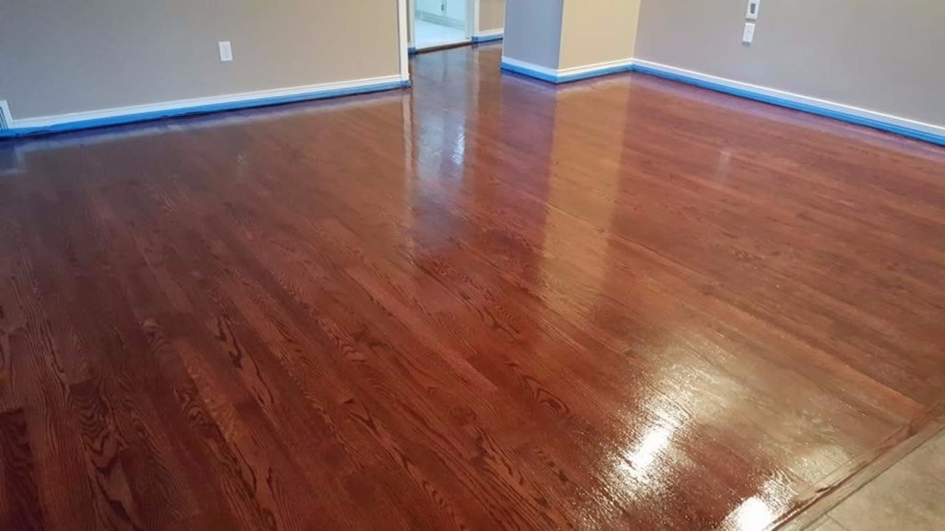 Image showing a dark stained floor, still showing signs of being wet