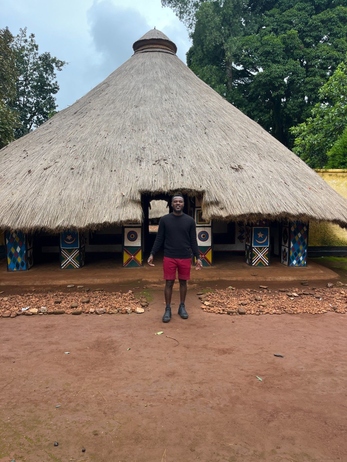standing in front of a beautiful unique architecture in Idool village