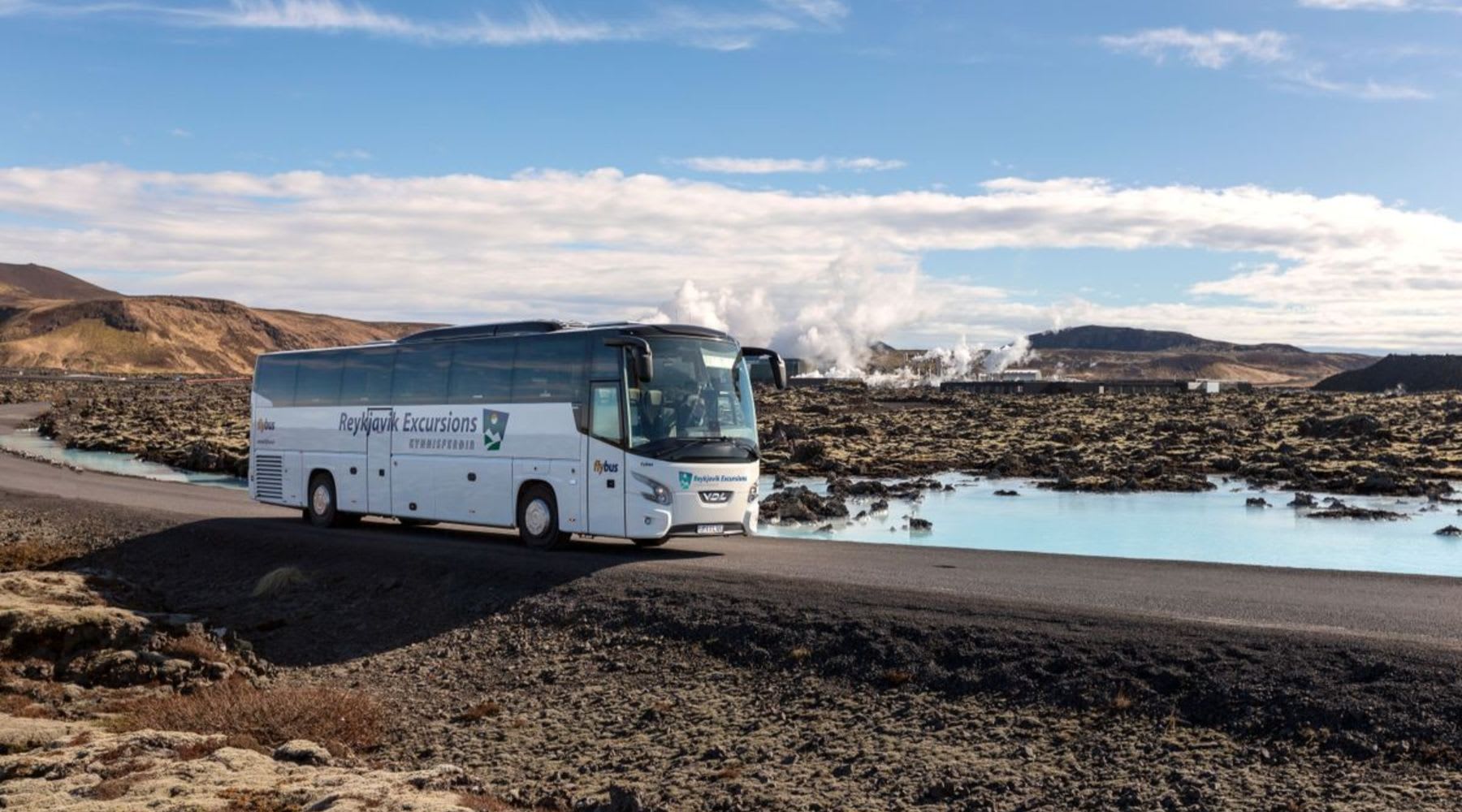 Reykjavik Excursions bus parked near the Blue Lagoon geothermal area in Iceland