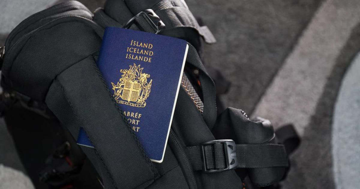 Icelandic passport resting on a black travel backpack, representing essential documents for Americans planning a trip from the US to Iceland.
