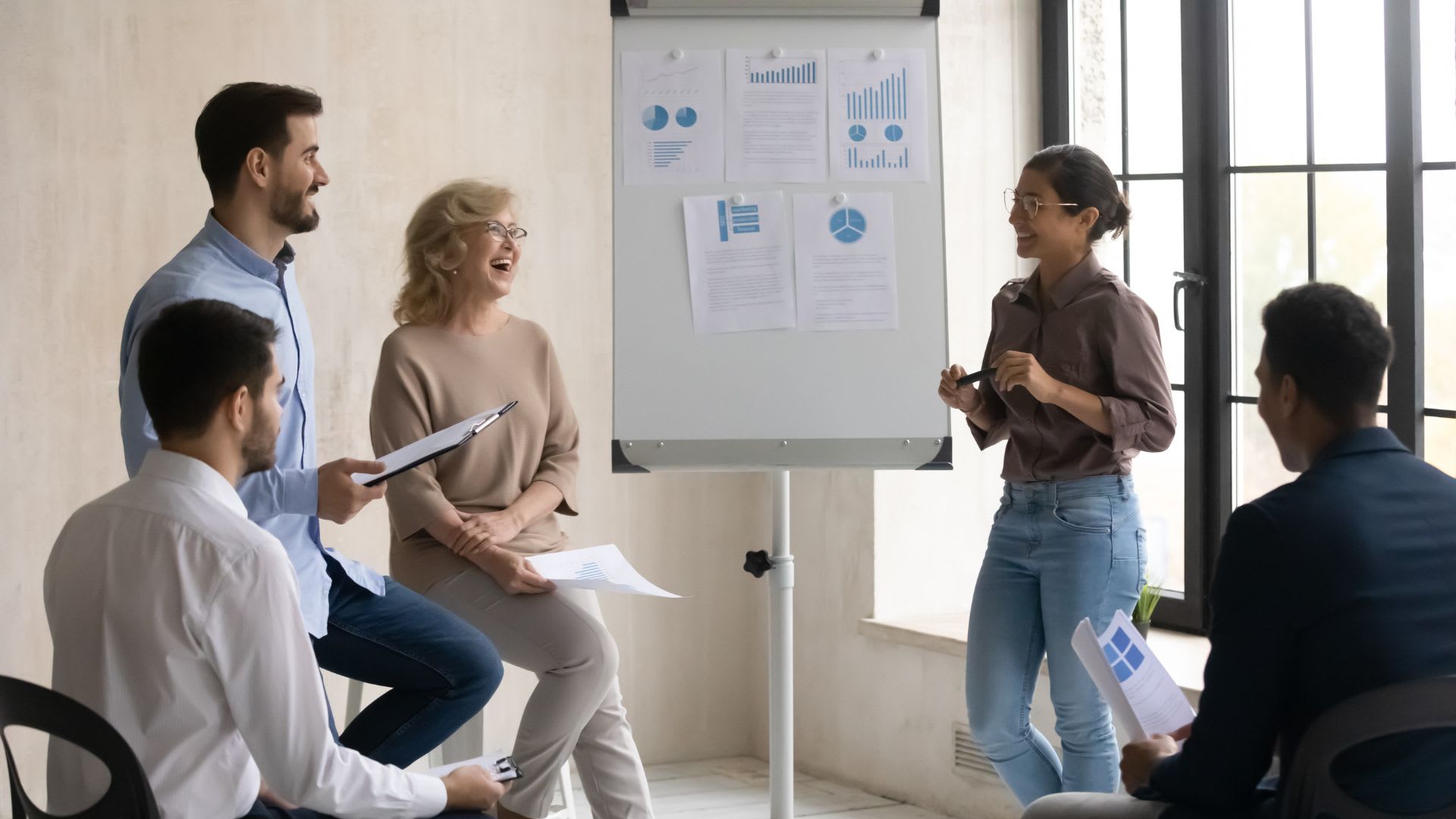 Content employees discussing positive business results, emphasizing the impact of employee satisfaction and leadership on business success.