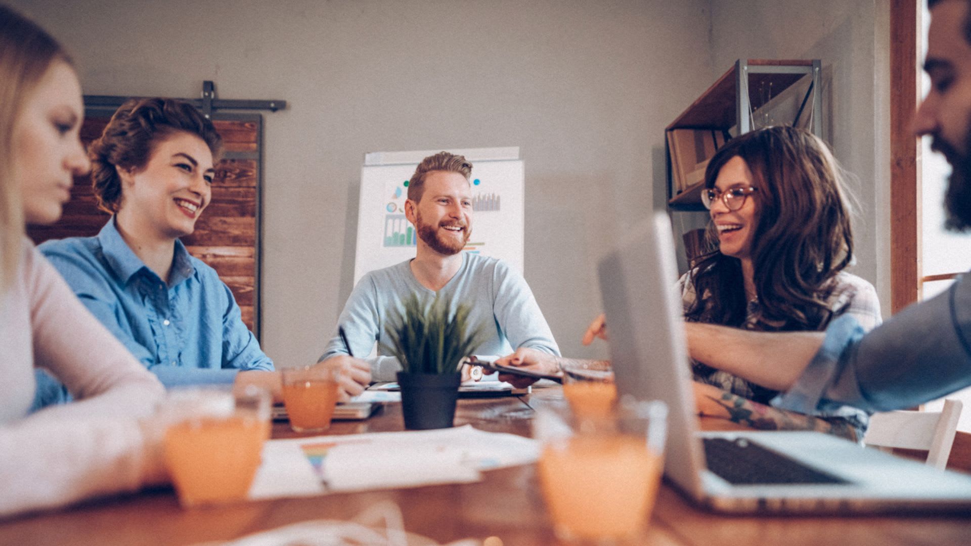 Group of business people sitting together in a collaborative meeting.