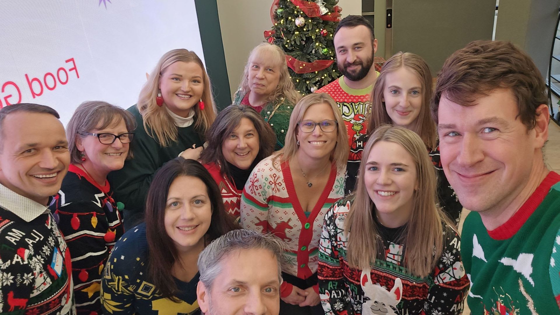 Image of Opus IVS staff celebrating the holidays, highlighting camaraderie and teamwork. 
