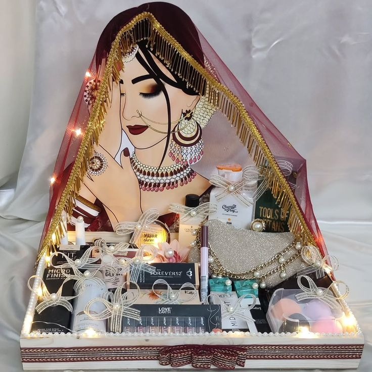 Bridal makeup gift tray with fairy lights and painted bride backdrop