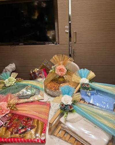 Bridal lehenga gift wrapping with pearls and roses