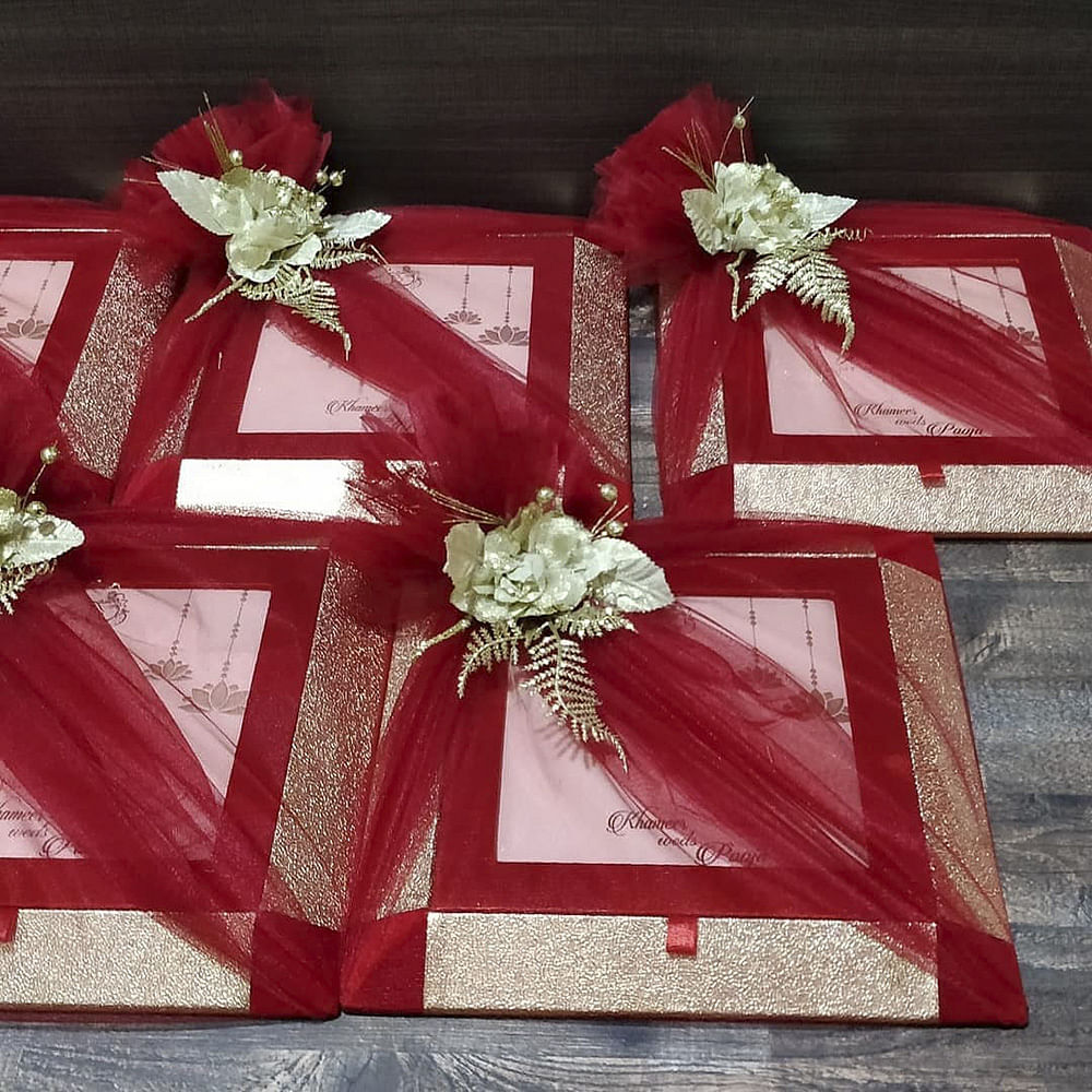 Wedding gift wrapping with flowers and satin ribbons
