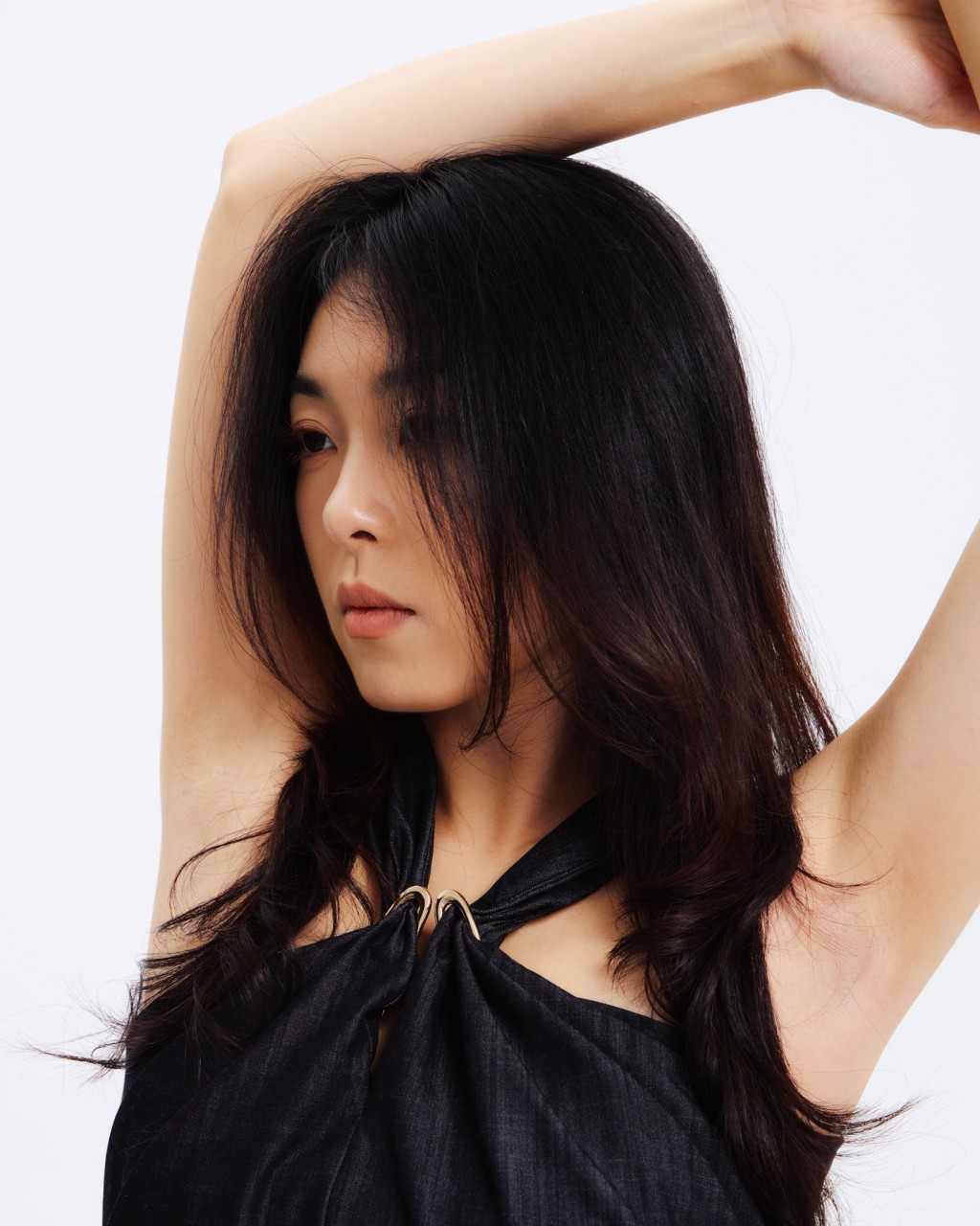 Lookbook fashion portrait featuring a dark halter garment