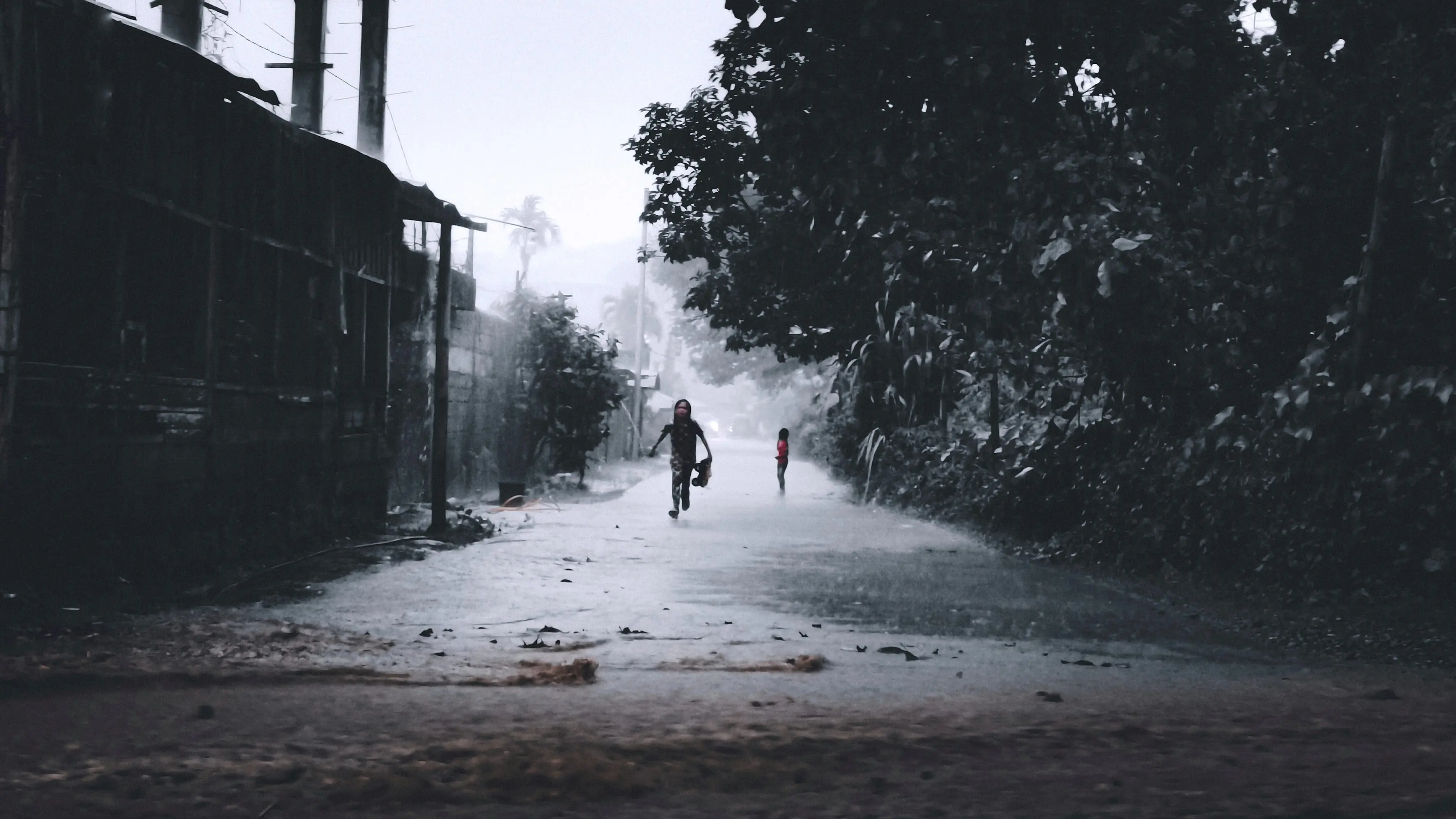 Storm Kids - Playing in the rain - Photography by Ryan Walloh