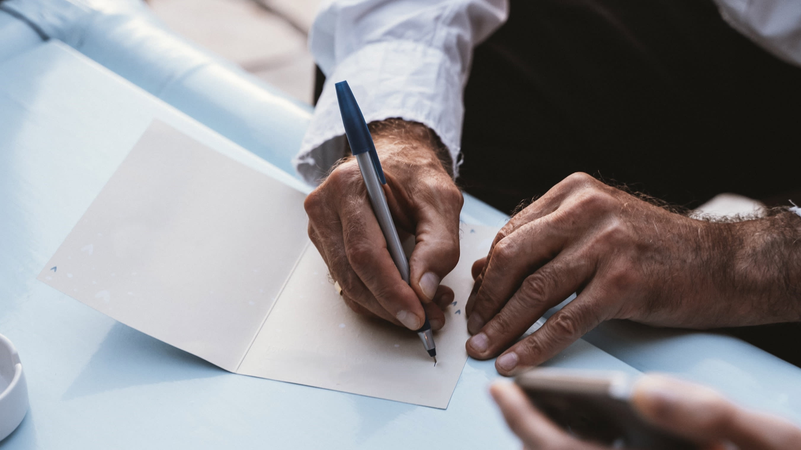 manwritingondocument