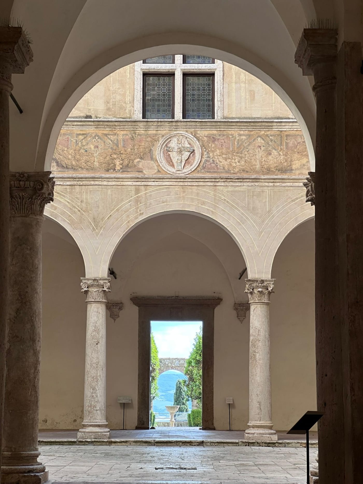 A loggia in Pienza framing the view over the Val d'Orcia