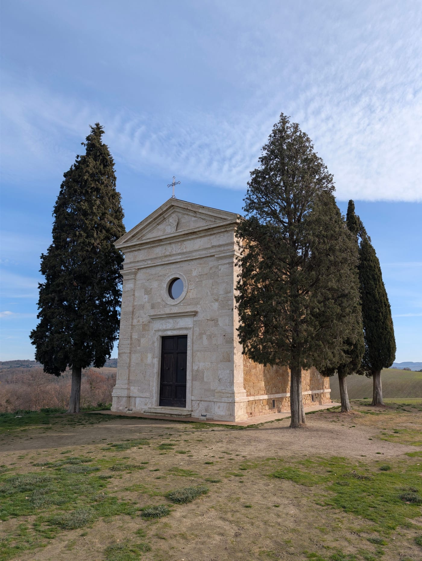 The Vitaleta chapel between its cypresses in the Val d'Orcia
