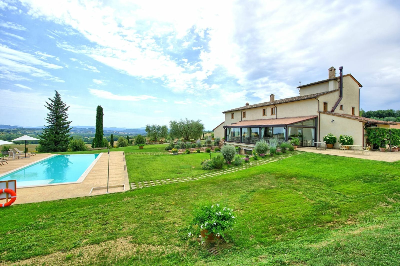 Tenuta La Barricaia — the stone villa above its infinity pool and garden