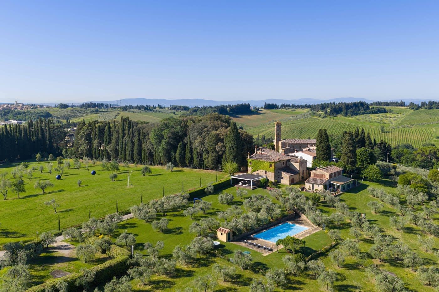 Villa Castellaro — the villa, its gardens and pool among the olive groves from above