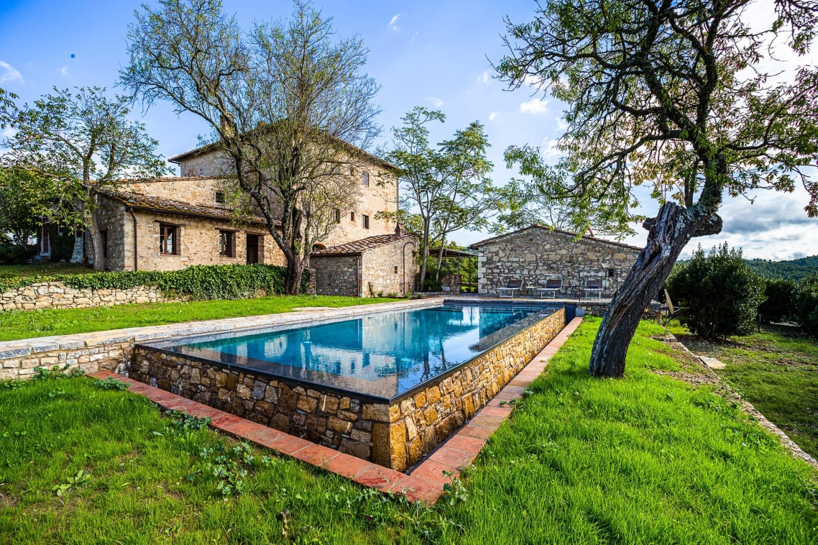 Casa dell'Erta — the infinity pool below the stone farmhouse