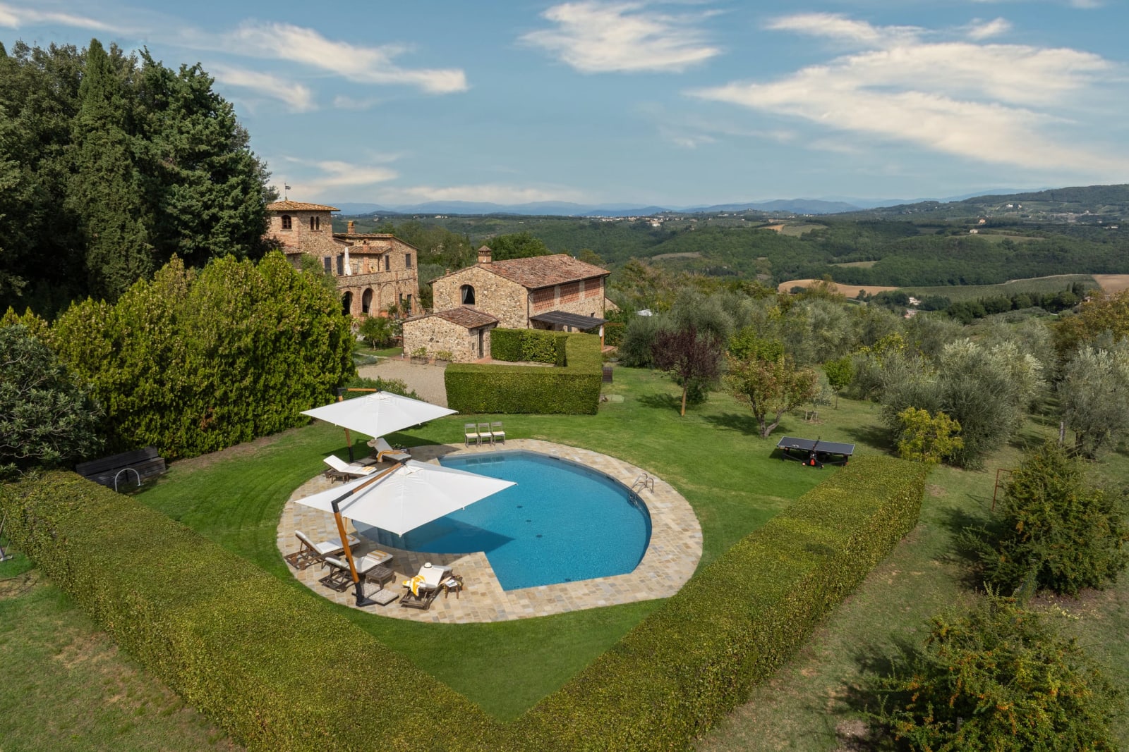 Casale Olivaio — the pool and farmhouse among the olive groves, from above