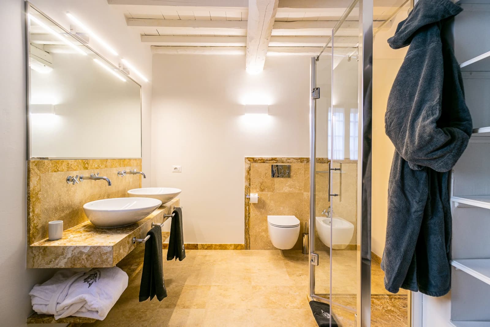 Casa dell'Erta — a travertine bathroom