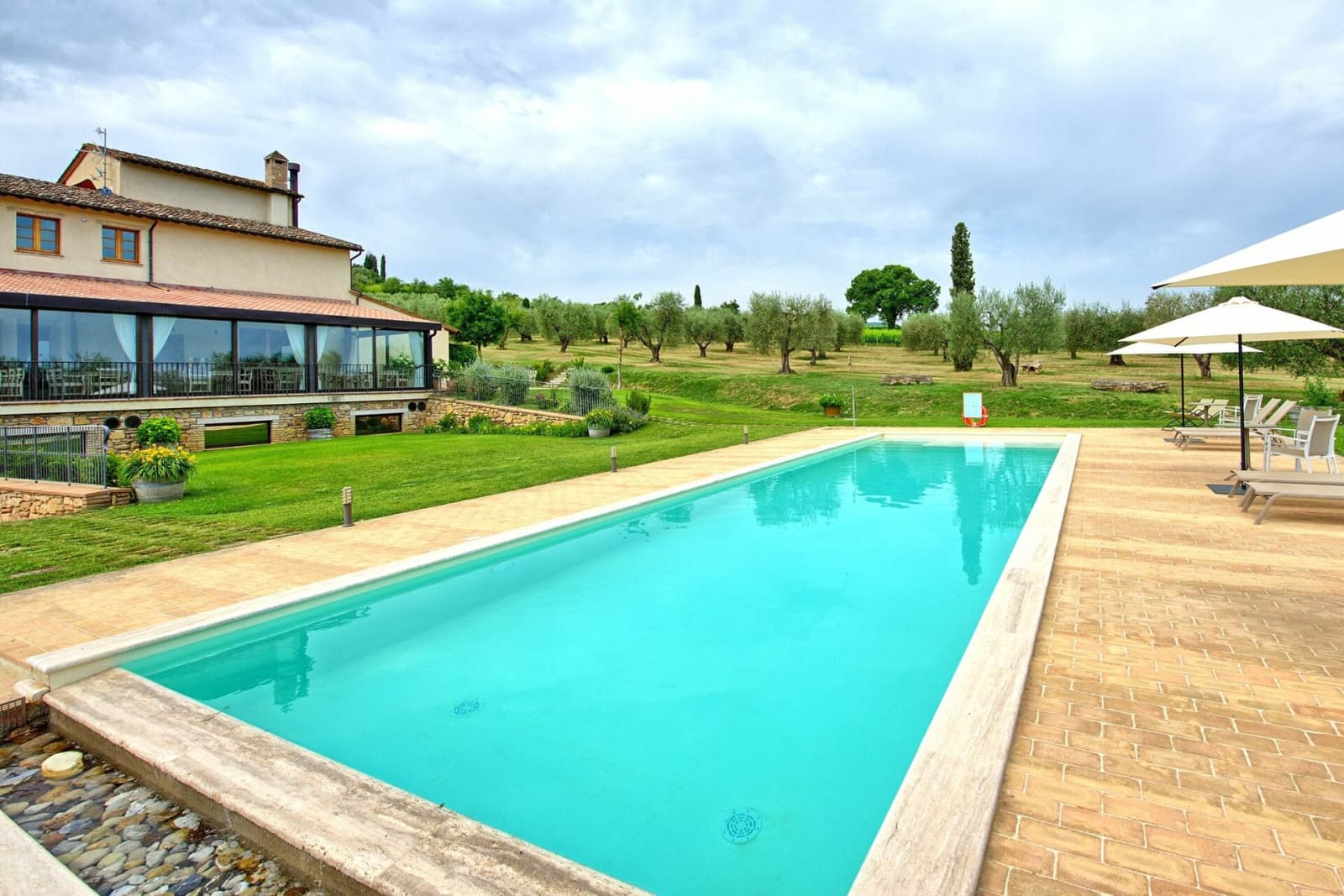 Tenuta La Barricaia — the pool beside the glass veranda